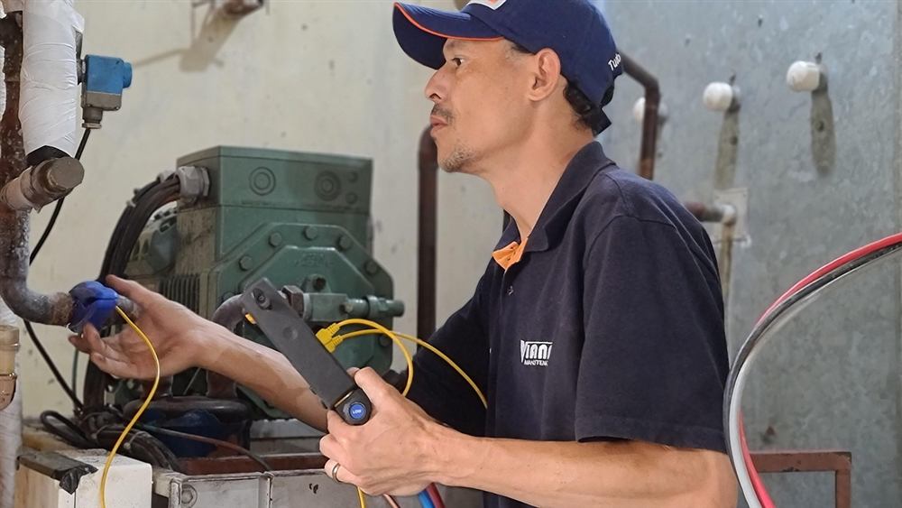 HVAC technician checking an air conditioning system