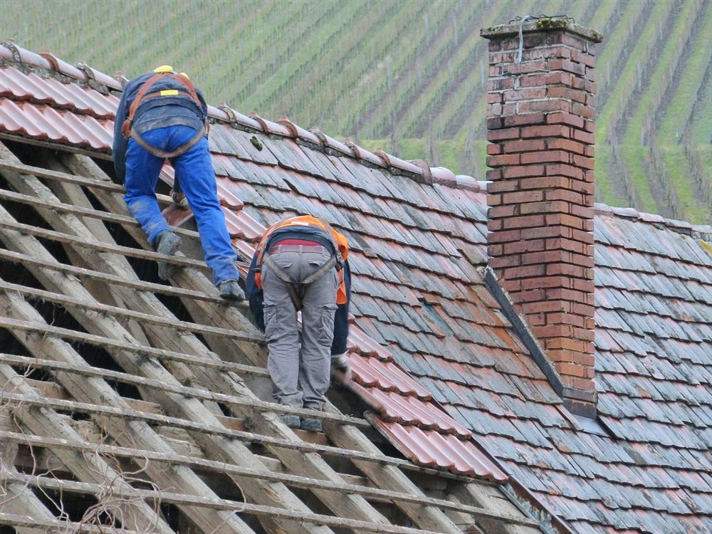 Our roofing crew working on a residential roof